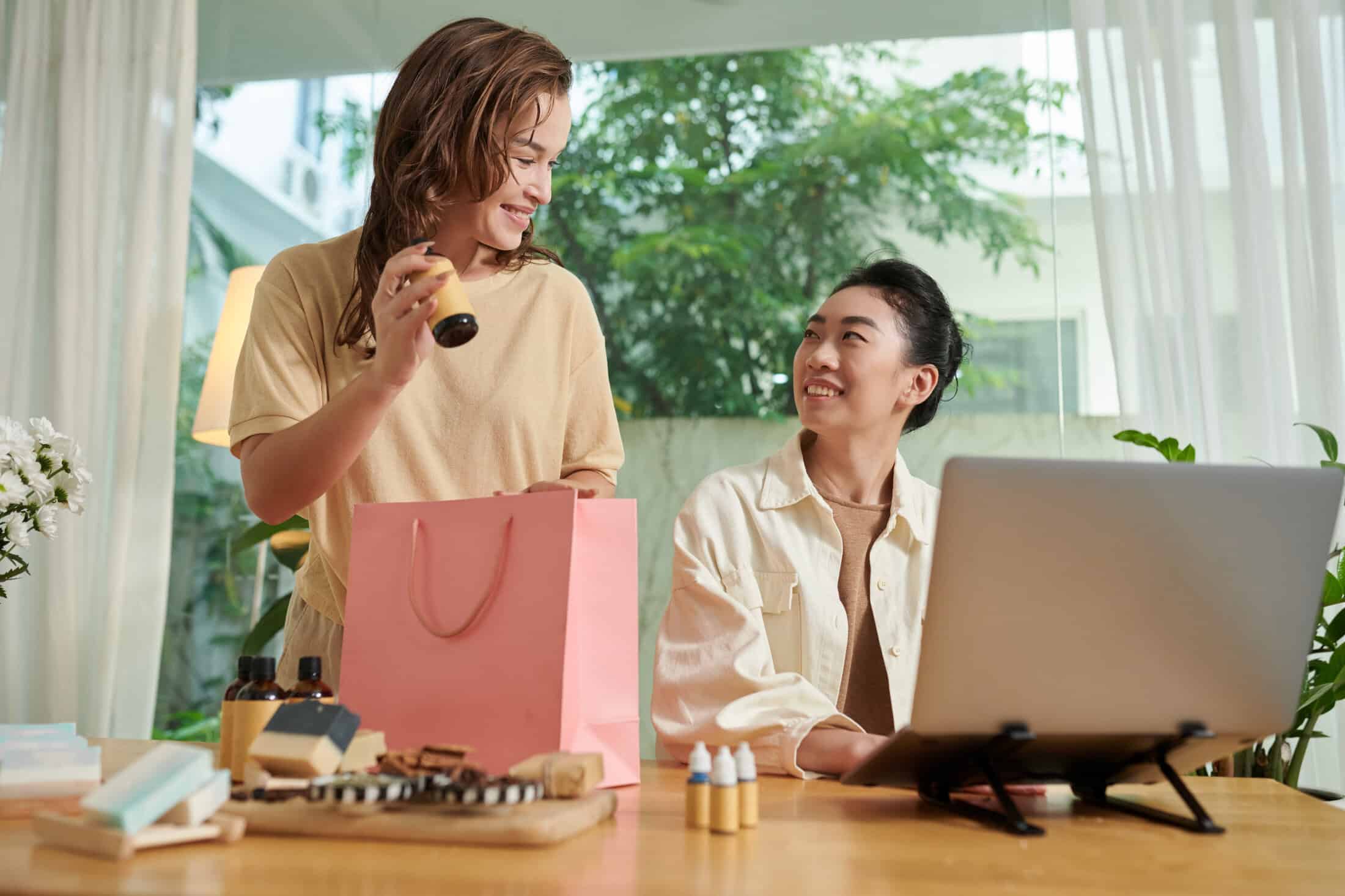 Small business owners celebrating their website sales.